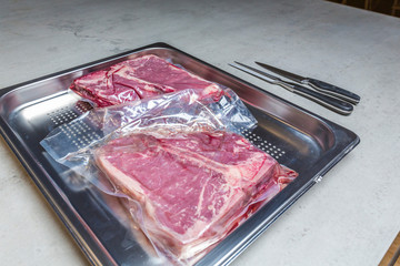 Elevatet view of beef in vacuum plastic bag for sous vide cooking