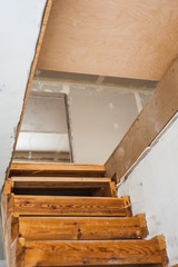 Wooden staircase on the second floor under construction