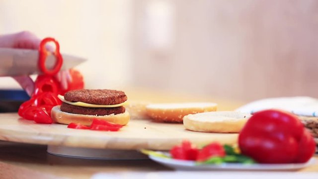 candind view at grilled mear and bun white cooking hamburger at home.