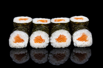 Hosomaki Sushi with Salmon on a black background