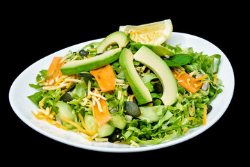 Green salad in a plate on black background