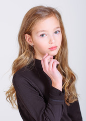 Naklejka premium portrait of little model girl in studio