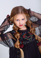 portrait of little model girl in studio