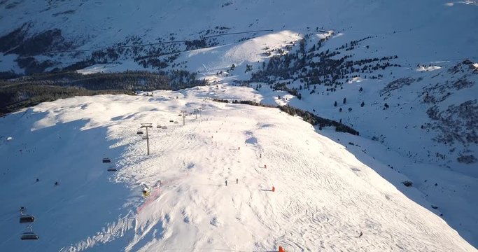 Beautiful ski field in the Swiss Alps, Aerial view as sun begins to set 4k