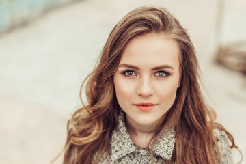 Fototapeta premium Close up portrait of young sad depressed girl outdoors. Casual, natural beauty, sadness concept