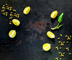 Food background with citrus fruit lime and cardamom on vintage rusty metal background. 