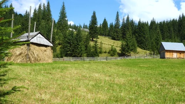 rustic timbered houses and ground road at the mountain hill