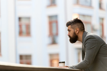 Businessman well groomed appearance enjoy coffee break out of business center urban background....