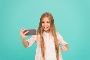 Video call concept. Girl hold smartphone taking selfie. Selfie for social networks. Streaming...