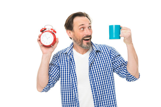 Morning habits. Take control of time. Check time. Tips for saving time. Self discipline. Control and discipline. Drink coffee every day same time. Pleasant moment. Man hold alarm clock and mug coffee