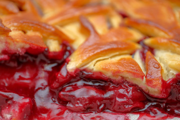 Cake from dough with cherry filling. Close up.