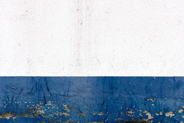 Muro pared de cemento bicolor azul y blanco