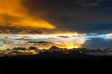 Sunset in Central America, Guatemala, Latin America, volcanoes and mountains, volcano called Water and volcano called Fuego.