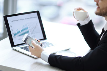 closeup.a successful businessman,working in a modern office