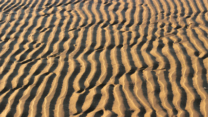 Textured sand with shadows