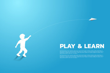 silhouette of boy running to throw out origami paper airplane. Concept of children play and learn.