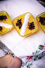 yellow pudding with coconut decoration