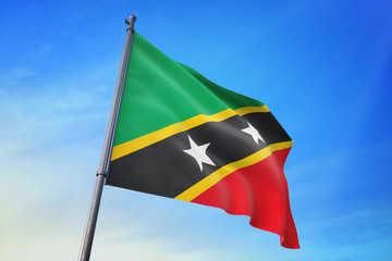 Saint Kitts and Nevis flag waving on the blue sky 3D illustration