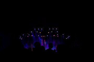 Silhouettes of people at live festival concert