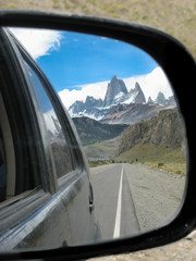 The Fitz Roy mountain over the blue sky from the road