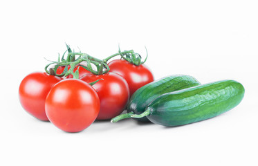 ripe fresh grape tomatoes and cucumbers isolated on white  background. Cherry tomato and cucumber vegetable salad concept