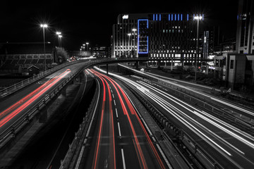 Fototapeta na wymiar Traffic in city at night with light trails