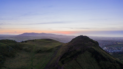 Fototapeta na wymiar Aerial view over Arthur's Seat mountain, the main peak of the group of hills in Edinburgh, Scotland