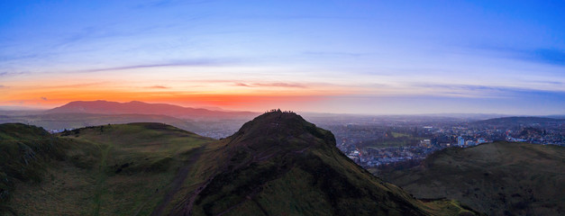 Fototapeta na wymiar Aerial view over Arthur's Seat mountain, the main peak of the group of hills in Edinburgh, Scotland