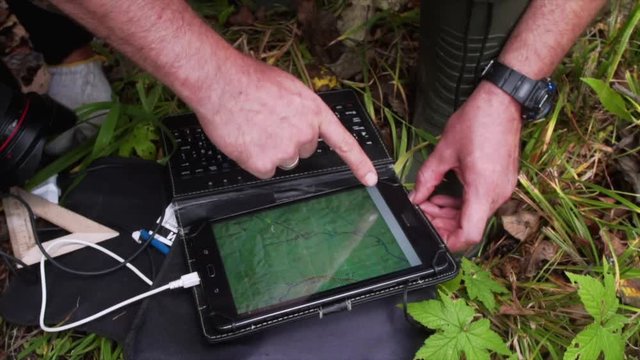 Tourists check the route on ipad map. Sikhote-Alin Nature Reserve, Russia