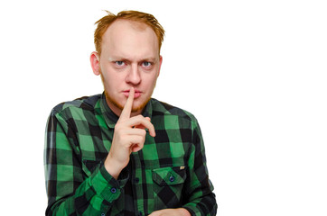 crazy, scared red haired man show gesture silence. angry caucasian male geek, nerd with hangover....