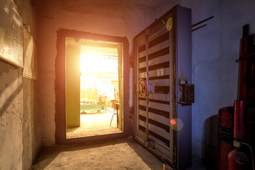 Opened hermetic metal armored door with valve, entrance of bomb shelter protective construction of civil defense