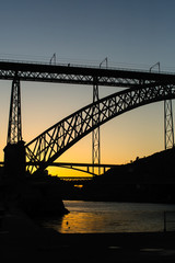 Silhouette of the Dom Luis I Bridge before dawn, Porto - Portugal.
