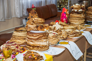 A variety of original pancakes in the contest during the celebration Russian Shrovetide (pancake week) at school