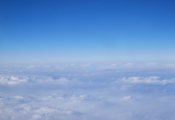 Fototapeta na wymiar Beautiful Above clouds from an airplane