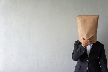 Unrecognized businessman cover his face with paper bag perform various action