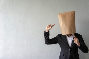 Unrecognized businessman cover his face with paper bag perform various action