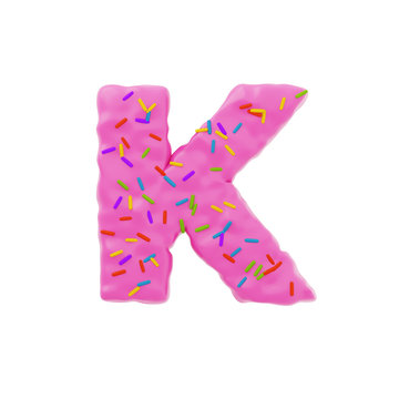 Isolated letter shaped cake with icing and sprinkles on top