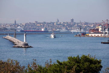 Lighthouse and breakwater at Kadikoy Coastline in Istanbul, Turkey.