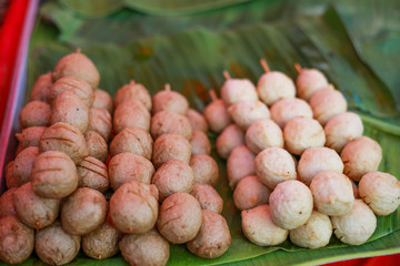 Meat balls inserted at bamboo for people