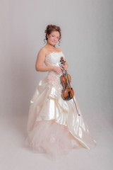 girl in a white dress with a violin