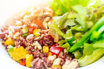 vegetarian food, fried black rice vegetables mix with salad.