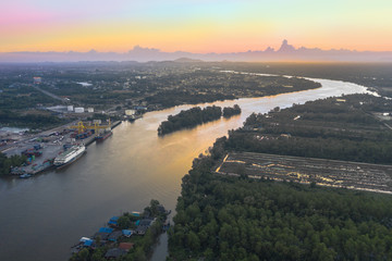 aerial photography sunset above Sri Surat bridge across Tapee river Surat Thani Thailand