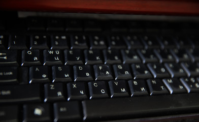 PC computer keyboard close up top side view working abstract background. Communication technology digital electronic device