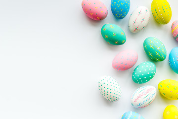 Decorated Easter eggs on white background border copy space