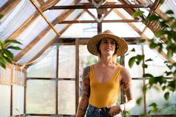 Beautiful woman in a greenhouse