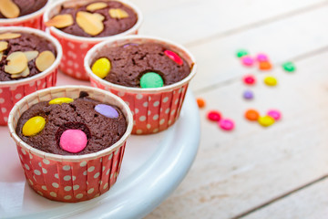 Brownie cupcakes or chocolate cupcakes.