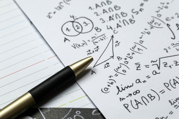 Fototapeta premium Math problems on graph paper with pencil ,formula arithmetic using for concept of World Maths Day.