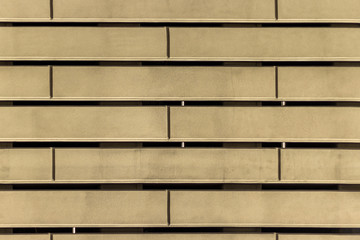Facade fragment of a modern office building. Exterior of glass wall with abstract texture
