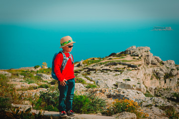 little boy travel in mountains at sea, family hiking in nature