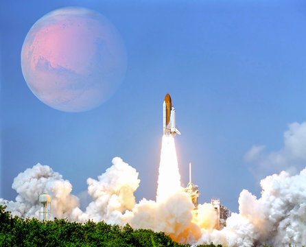 Launch of the spaceship from the spaceport to planet Mars. Futuristic space travel and tourism concept. Some elements of this image are furnished by NASA